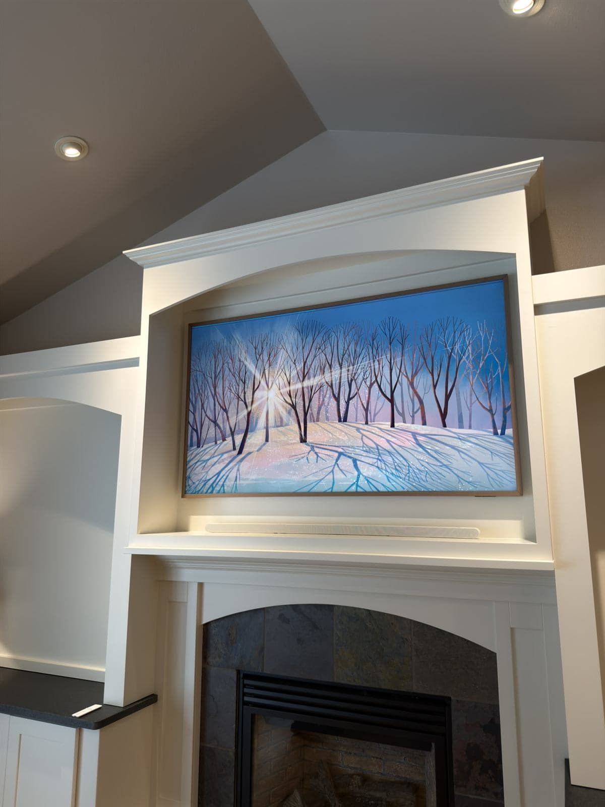 Frame TV with concealed wiring and hidden soundbar